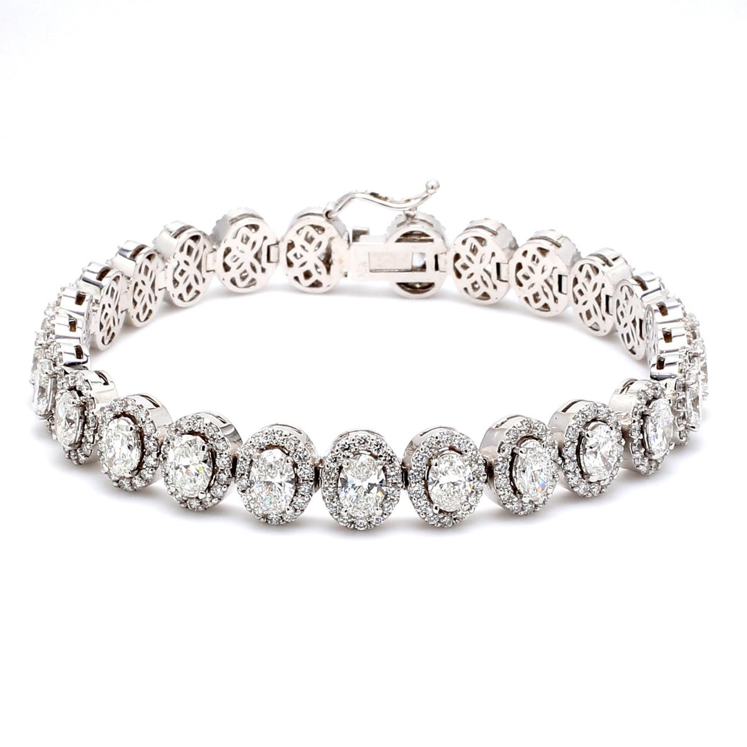 7"" Designer halo bracelet in 18K WG with prong set rounds & 4-prong set oval diamonds.  D11.60ct.t.w.