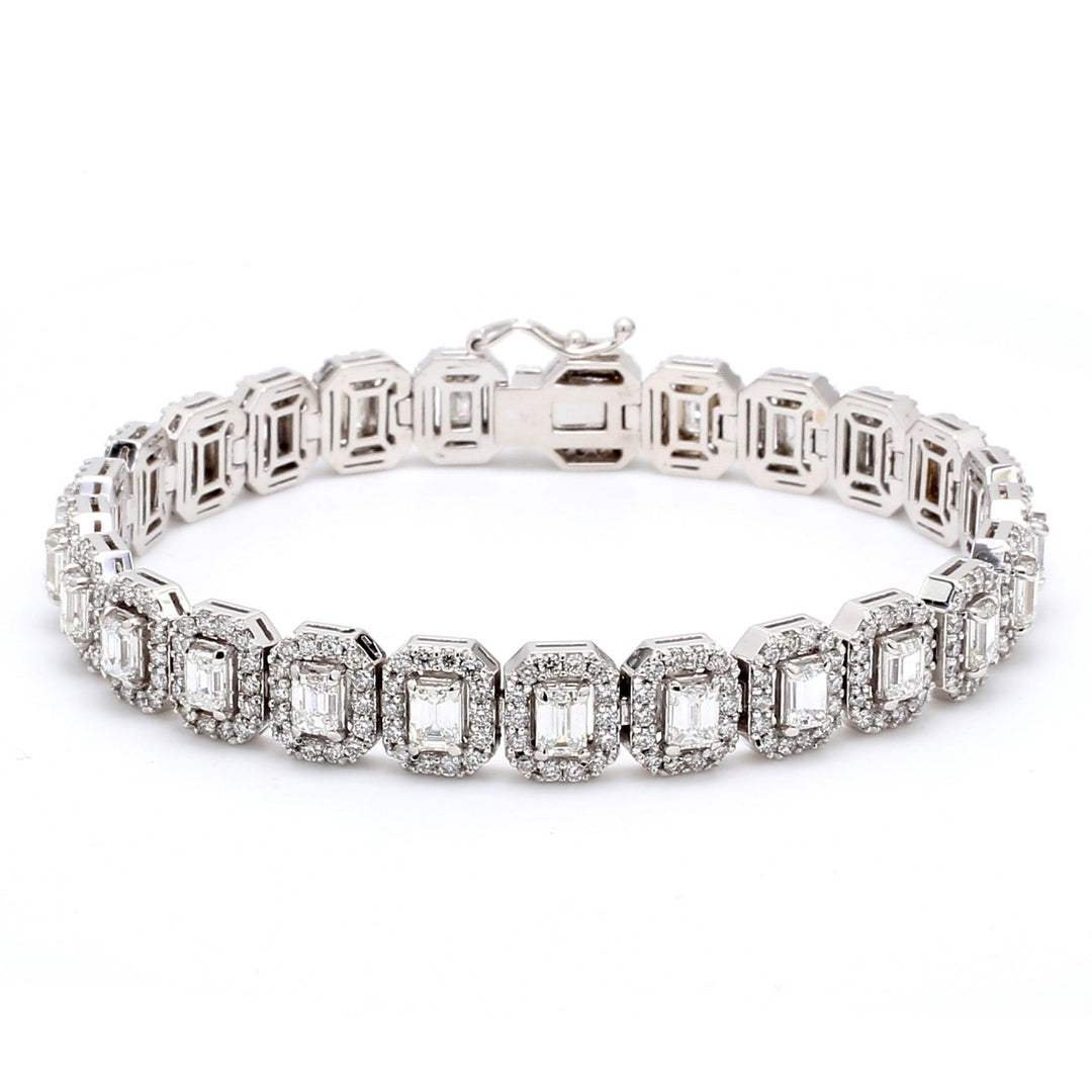 7"" Designer halo bracelet in 18K WG with shared prong set rounds & 4-prong set emerald cut diamonds.  D9.26ct.t.w.