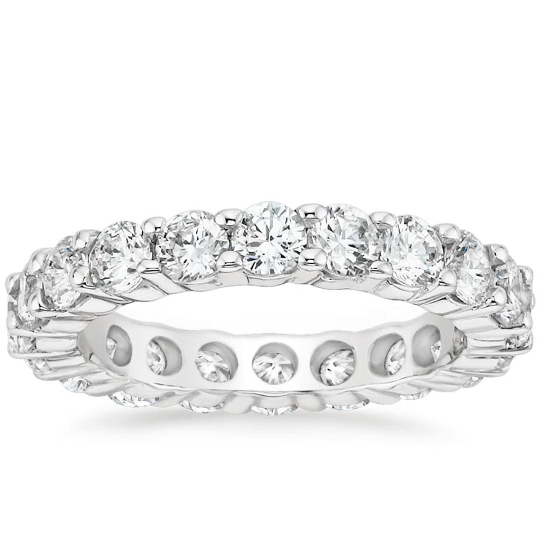 Eternity band in platinum with shared prong set (18) round diamonds.  D3.33ct.t.w.  Size 7