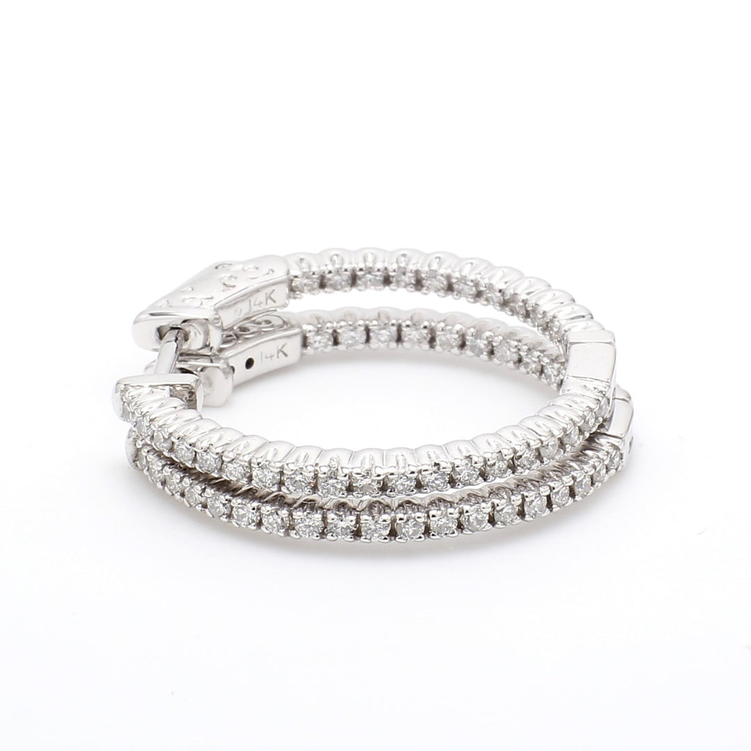 1"" Inside out hoop earrings with prong set round diamonds.  D0.69ct.t.w.