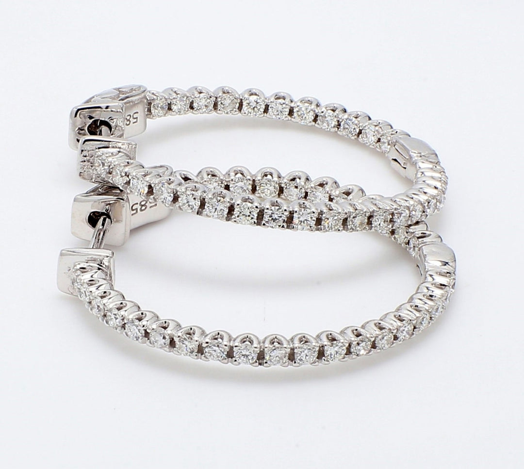 1.5"" Inside out hoop earrings with U-prong set (94) round diamonds & with special spring lock.  D1.39ct.t.w.