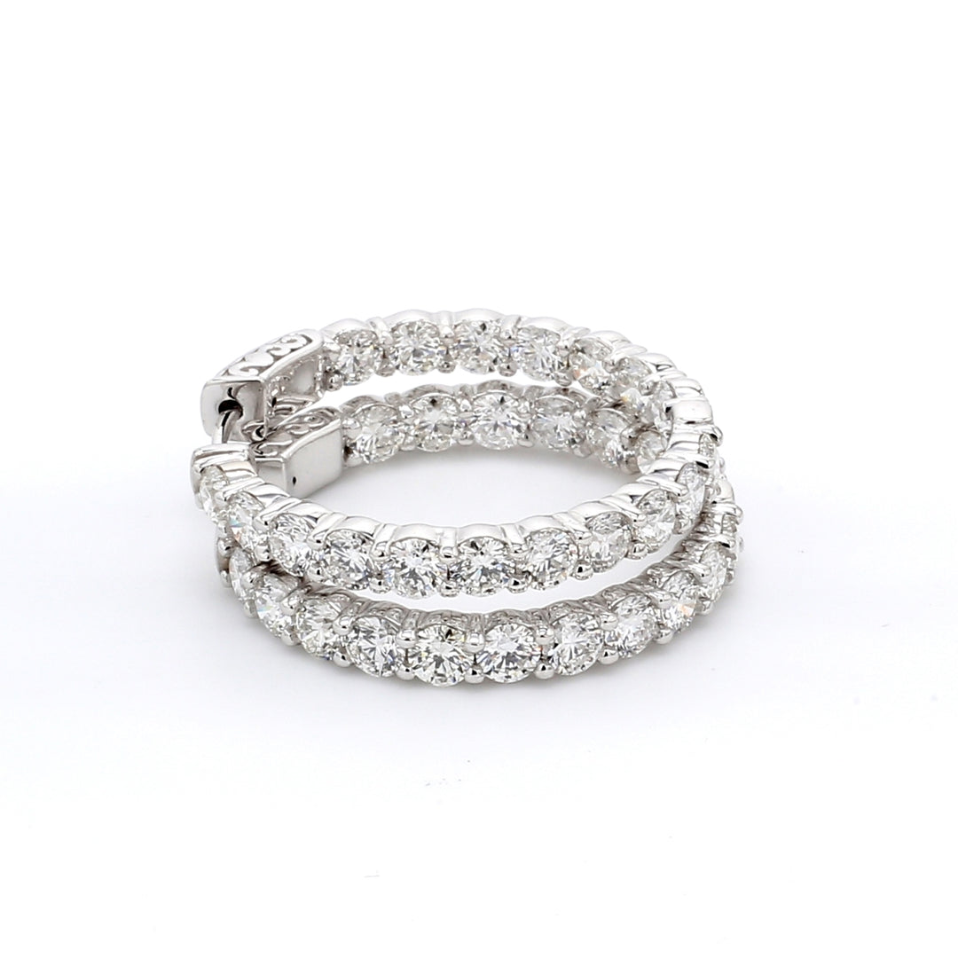 1.25"" Inside out hoop earrings with shared prong set F-G/VS2-SI1 round diamonds.  D6.90ct.t.w.