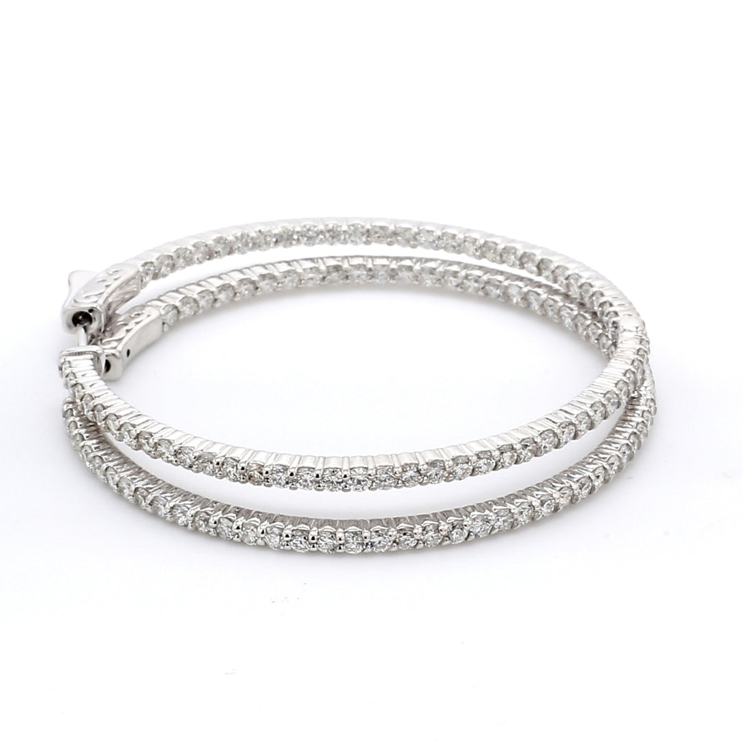 2.5"" Inside out hoop earrings with shared prong set G/VS2-SI1 round diamonds.  D2.92ct.t.w.