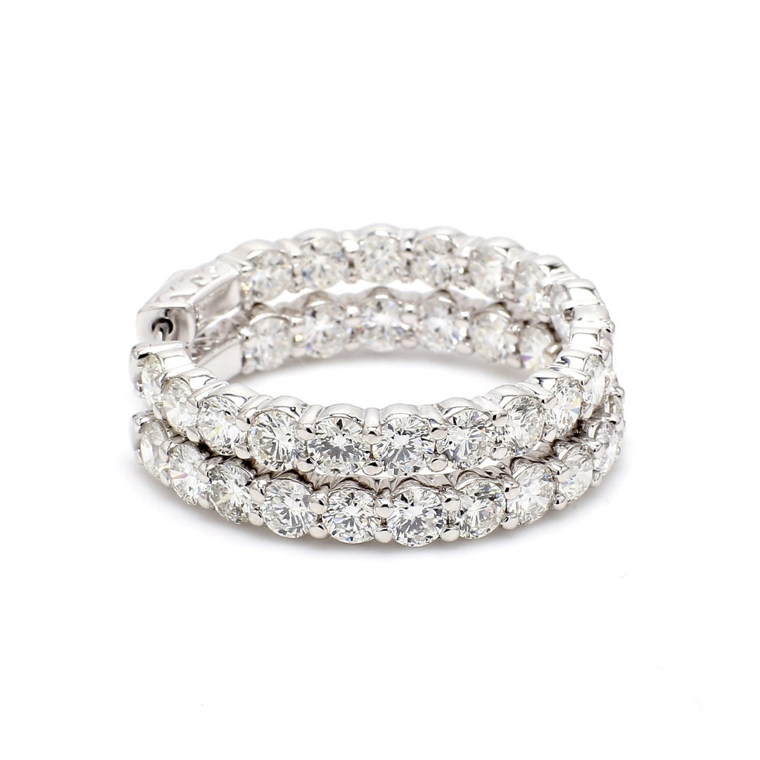 1.25"" Inside out hoop earrings with shared prong set round diamonds.  D7.72ct.t.w.