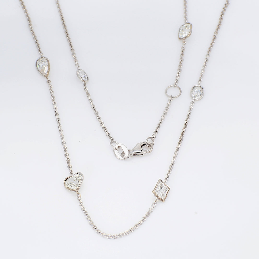 18"" Diamonds by the yard necklace in 18K WG with bezel set assorted heart, princess, oval, & pear shape diamonds.  D3.55ct.t.w.