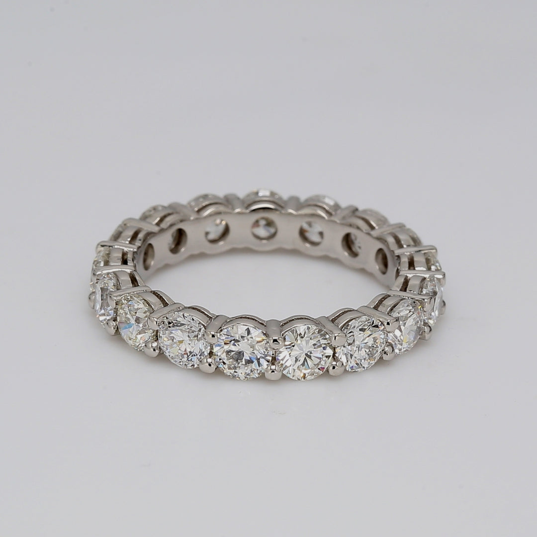 Eternity band in platinum with shared prong set round diamonds.  D3.24ct.t.w.  Size 5.75