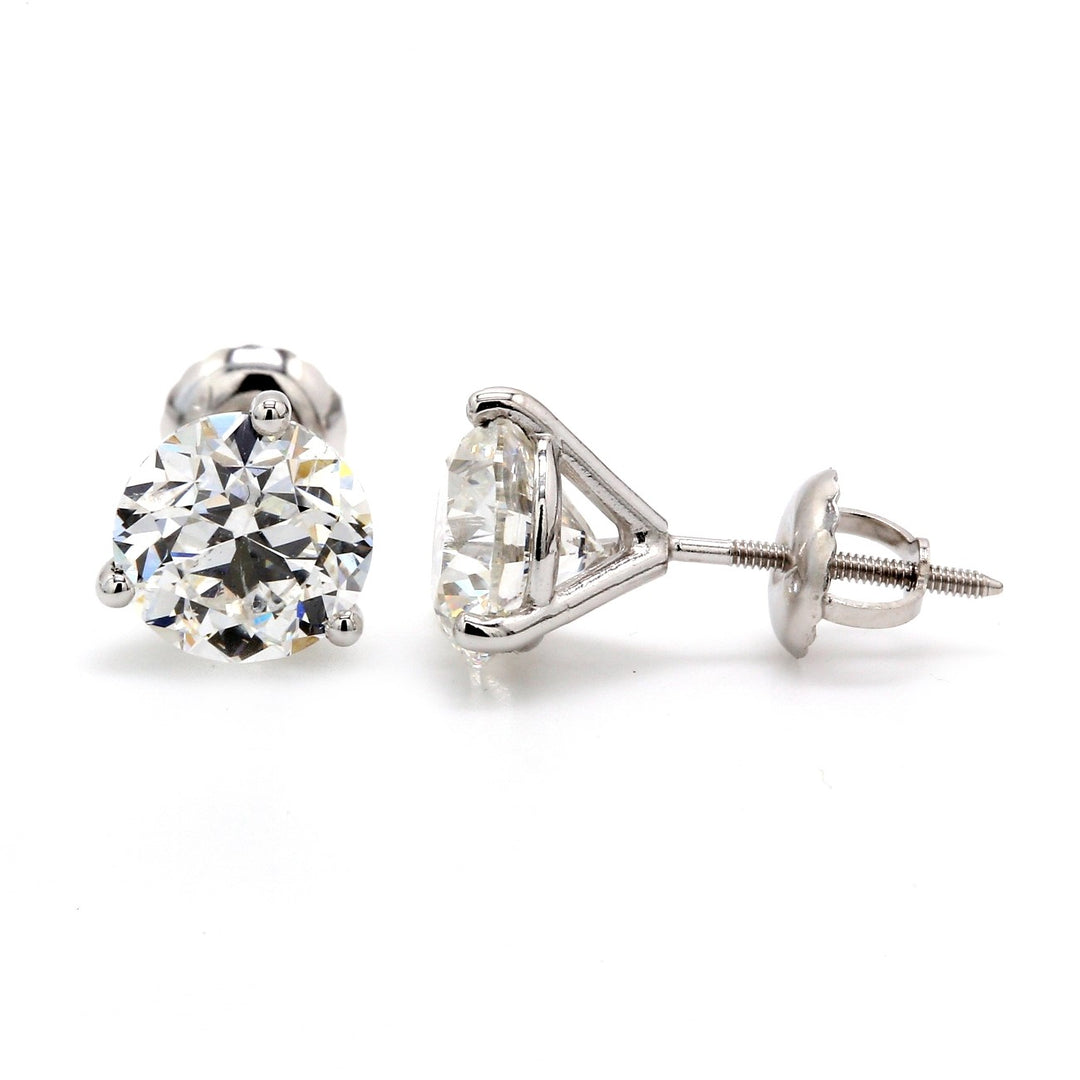 Screw back stud earrings with 3-prong set GIA certified F/SI2 round diamonds. D3.01ct.t.w.