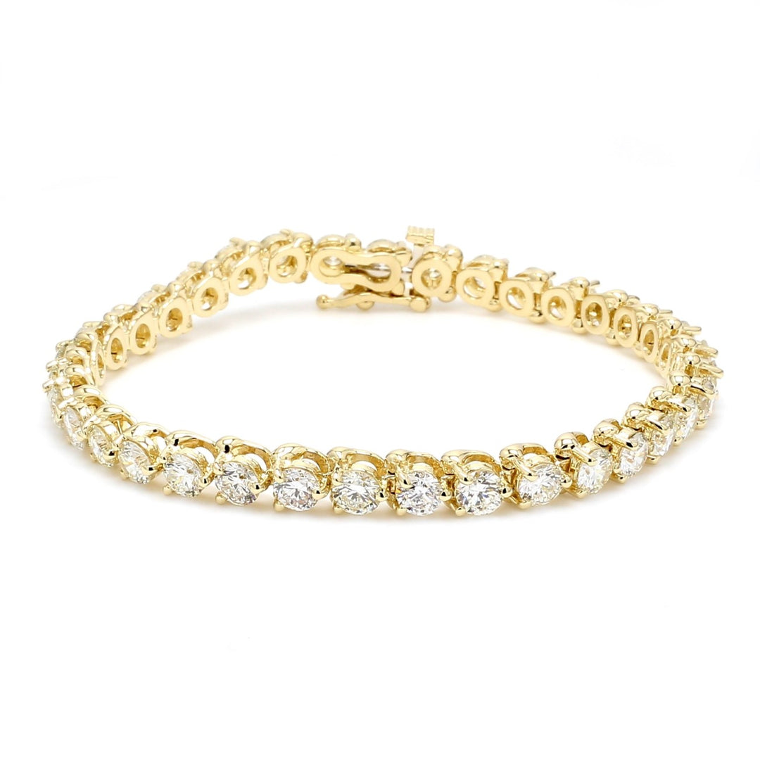 7"" Tennis bracelet in yellow gold with 3-prong set (35) round diamonds.  D9.50ct.t.w.