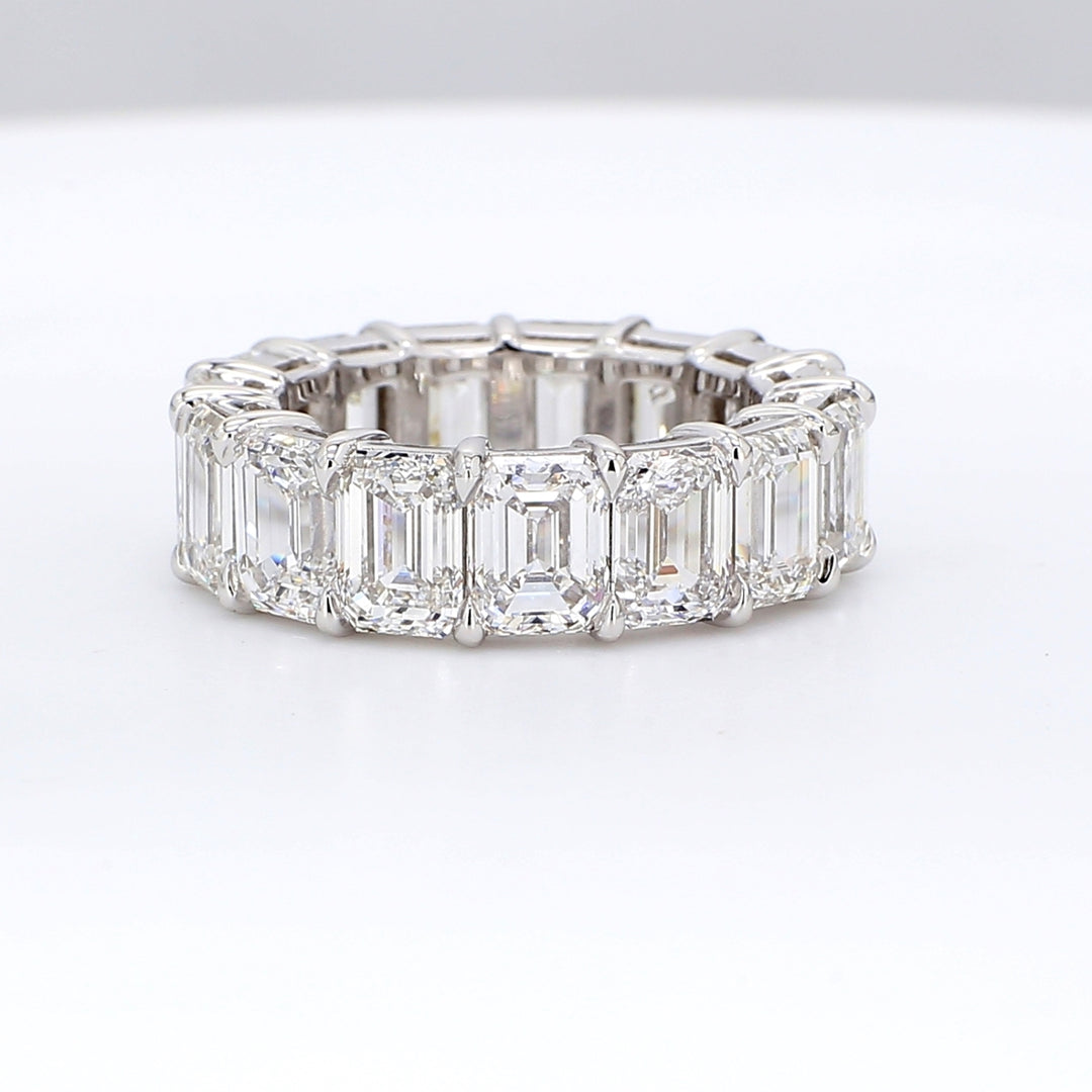 Eternity band in platinum with double basket shared prong set GIA certified D-F/VVS1-2 (15) emerald cut diamonds.  D11.02ct.t.w.  Size 5