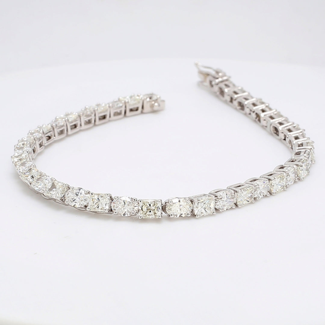 7"" Tennis bracelet with basket prong set alternating oval & radiant cut diamonds.  D10.62ct.t.w.
