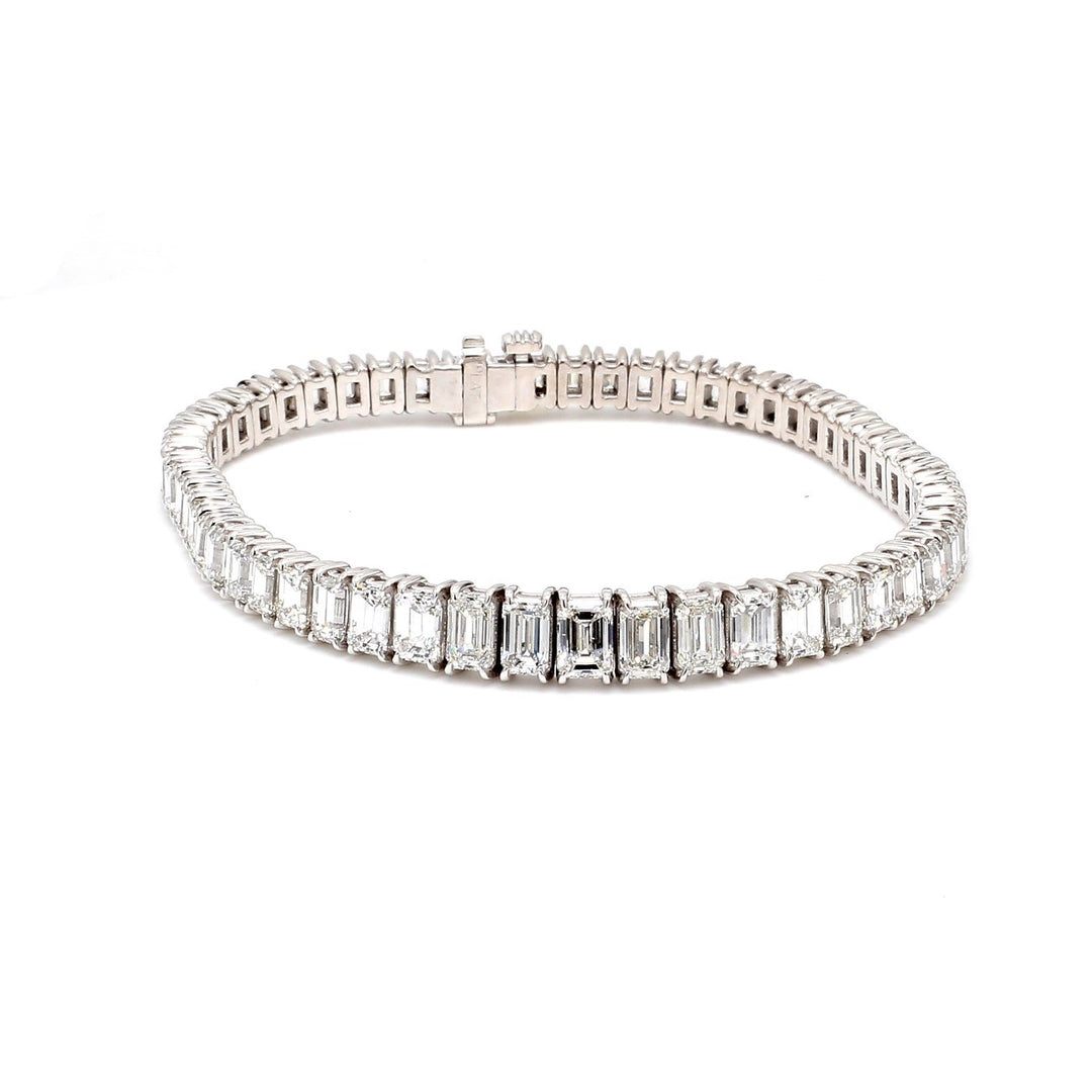 7"" Graduated tennis bracelet in platinum with 4-prong basket set F-G/VS-SI emerald cut diamonds.  D13.52ct.t.w.  (Center 0.50ct.)