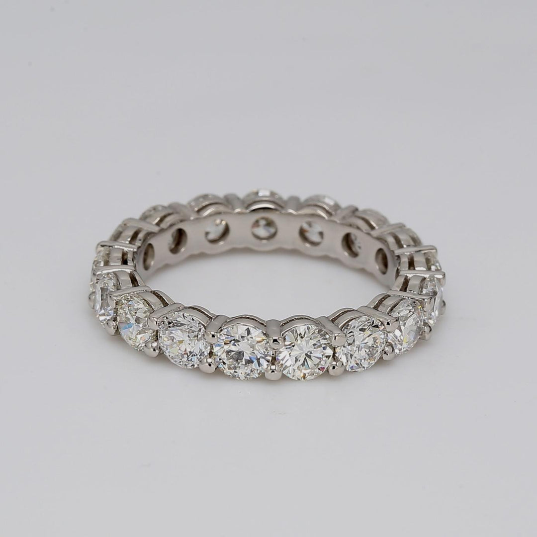 Eternity band in platinum with double basket shared prong set round diamonds.  D3.15ct.t.w.  Size 5.75