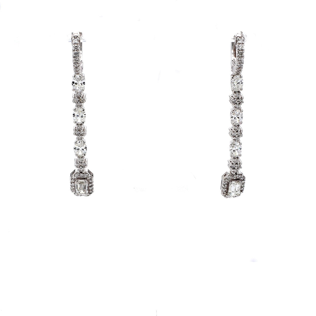 2"" Halo dangling earrrings with 4-prong set rounds, oval cuts & emerald cut diamonds.  D2.51ct.t.w.