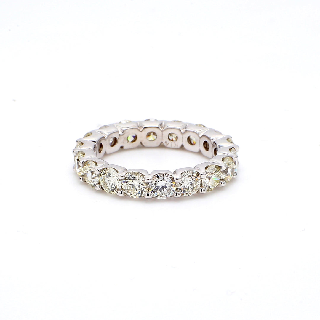 Eternity band with shared U-prong set round diamonds.  D4.90ct.t.w.