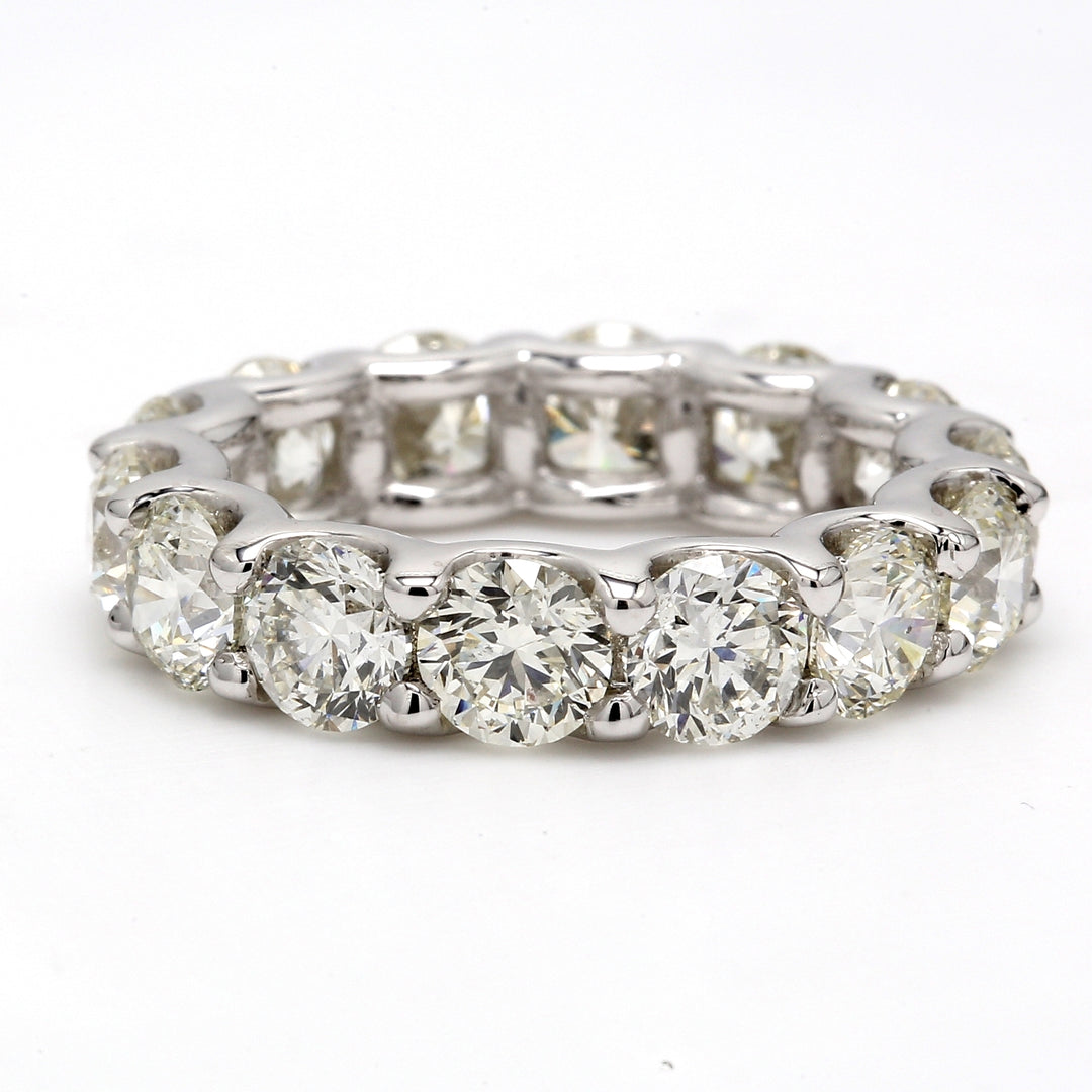 Eternity band in platinum with shared U-prong set (14) round diamonds.  D6.48ct.t.w.