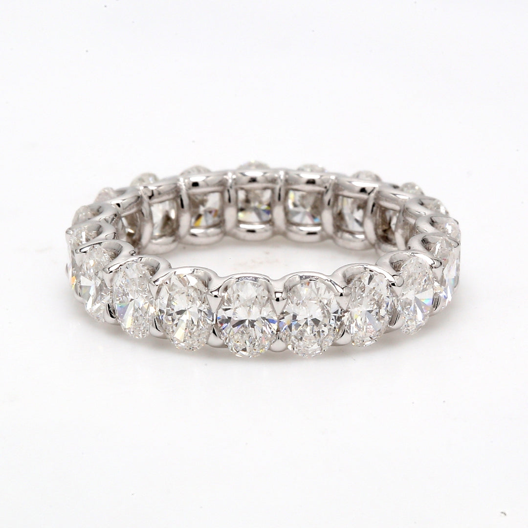 Eternity band in platinum with shared U-prong set oval diamonds.  D3.58ct.t.w.