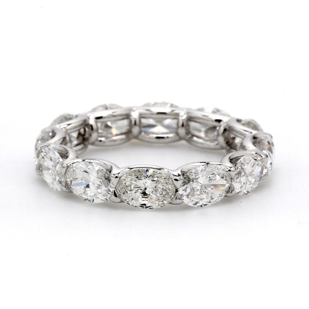 Eternity band in platinum with shared U-prong set (14) oval diamonds.  D2.70ct.t.w.  Size 6