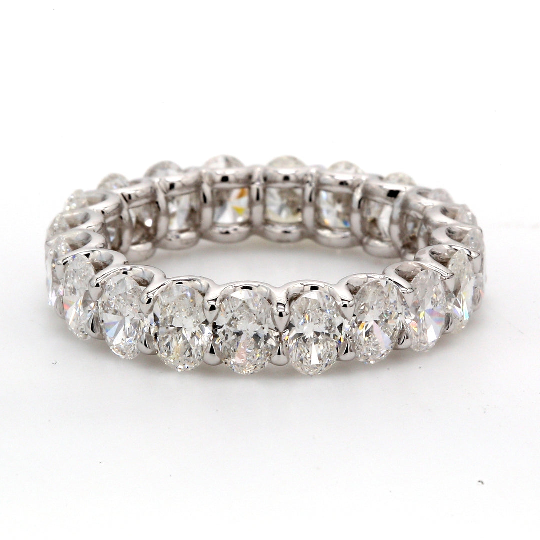 Eternity band in platinum with shared U-prong set (19) oval diamonds.  D3.96ct.t.w.  Size 6