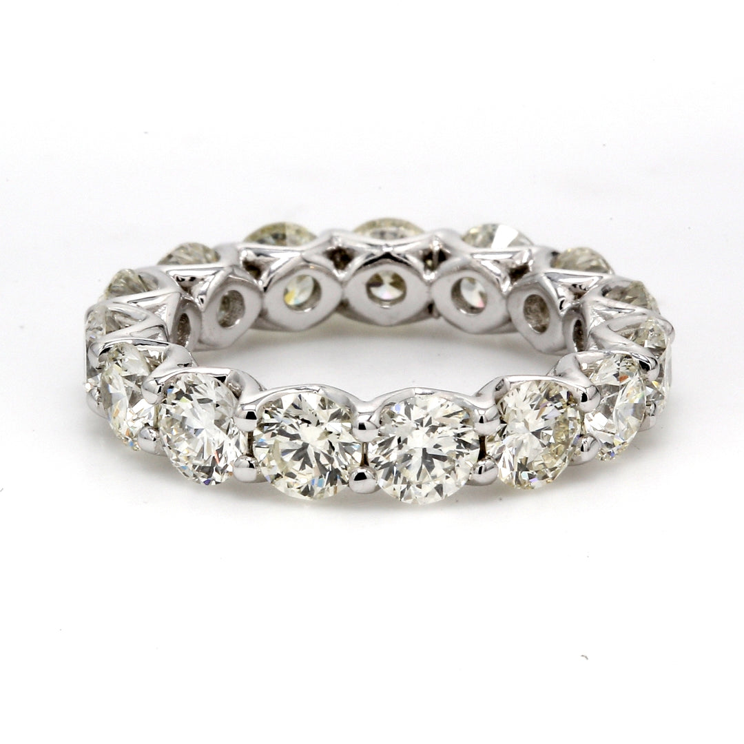 Eternity band in platinum with shared V-prong set round diamonds.  D4.11ct.t.w.
