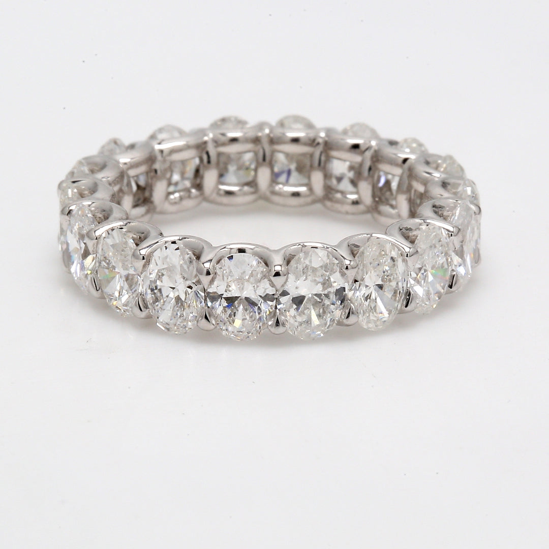 Eternity band in platinum with shared U-prong set oval diamonds.  D4.48ct.t.w.  Size 5.25