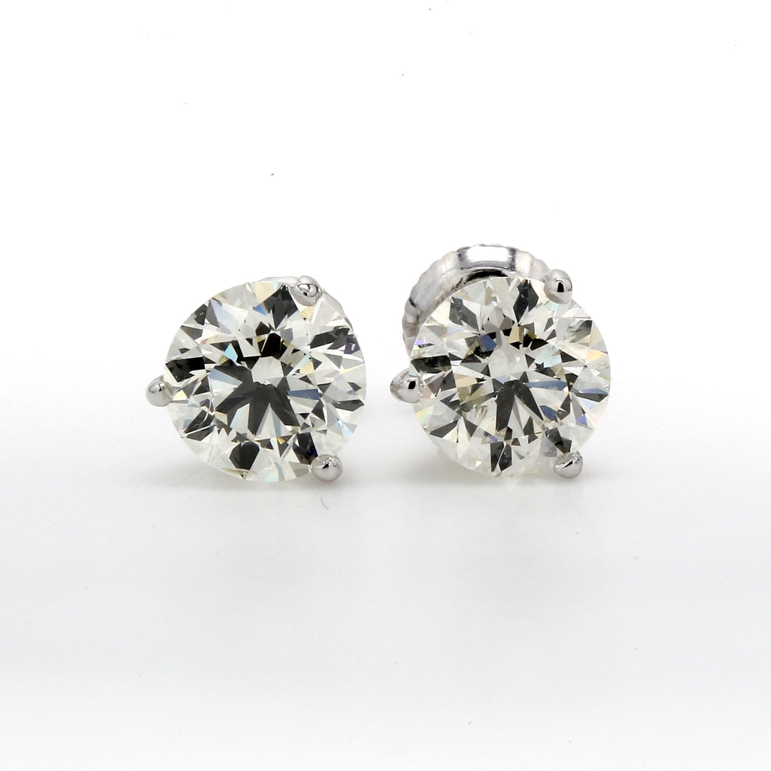 Screw back martini style stud earrings with 3-prong set round diamonds.  D3.00ct.t.w.