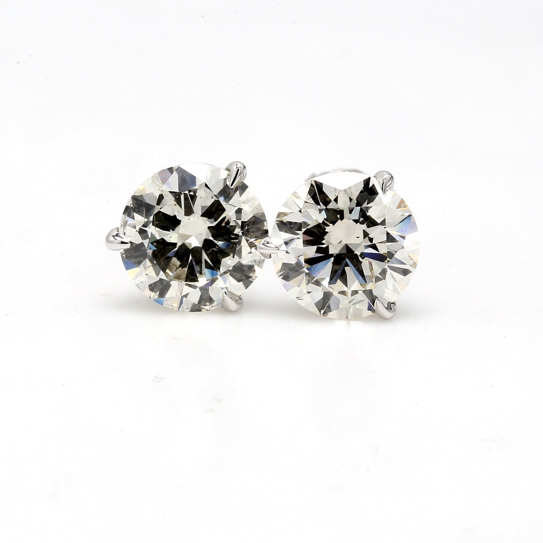 Screw back stud earrings with 3-prong set round diamonds.  D4.02ct.t.w.