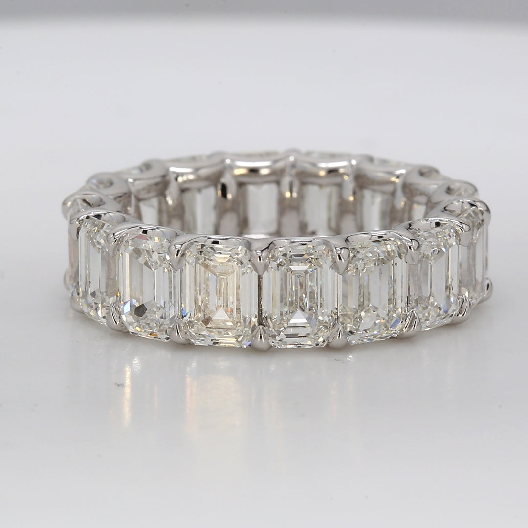 Eternity band in platinum with U-prong set GIA certified G-H/IF-VS (16) emerald cut diamonds.  D8.49ct.t.w.  Size 5.5