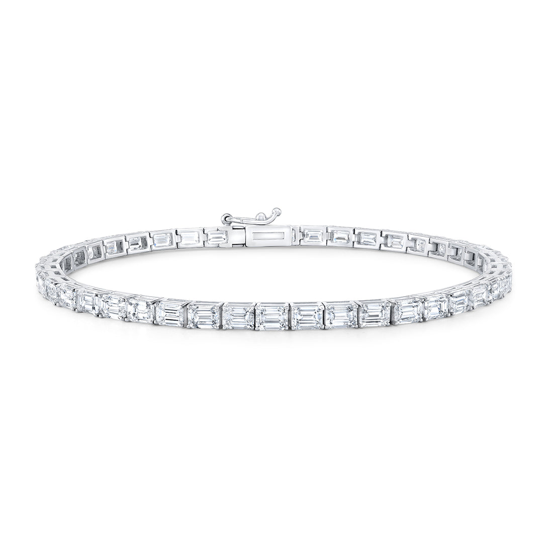 7"" East to west style tennis bracelet in platinum with prong basket set emerald cut diamonds.  D10.79ct.t.w.