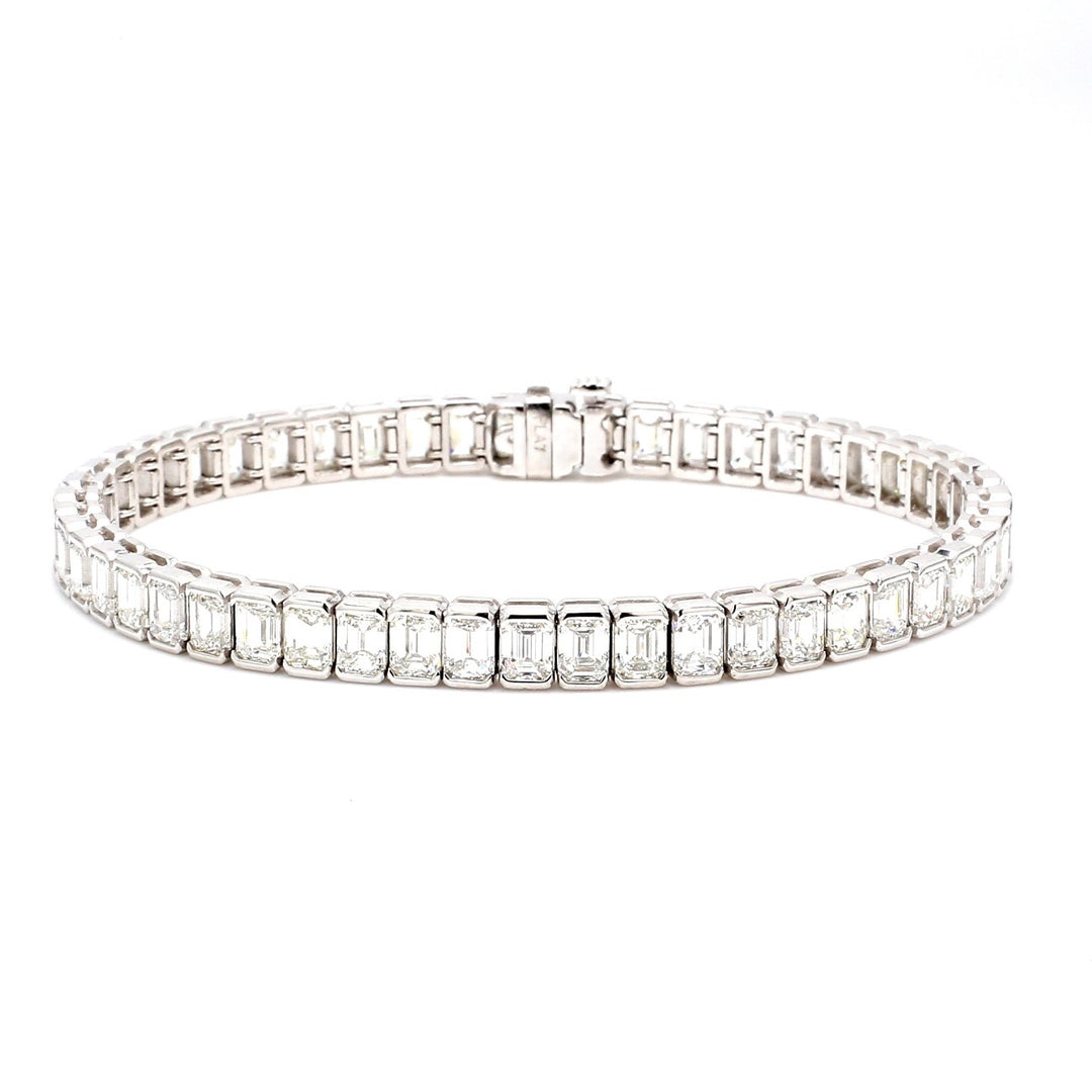 7"" Tennis bracelet in platinum with half bezel set (54) emerald cut diamonds.  D13.04ct.t.w.