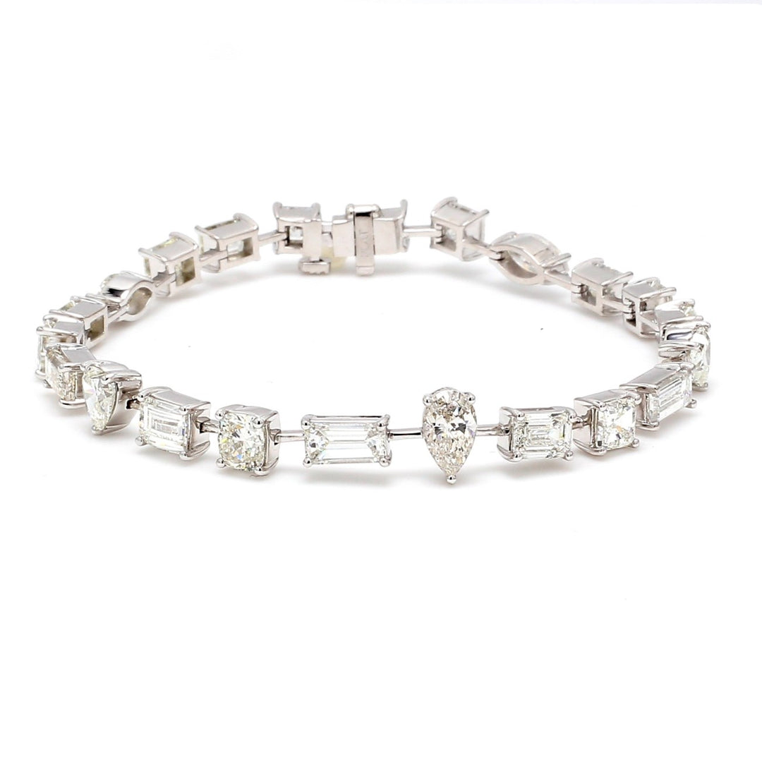7"" Tennis bracelet in platinum with prong set alternating assorted shape diamonds.  D11.43ct.t.w.