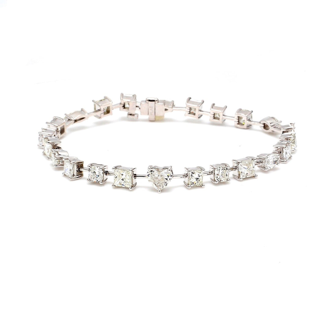 7"" Tennis bracelet in platinum with alternating prong set assorted shape diamonds.  D8.63ct.t.w.