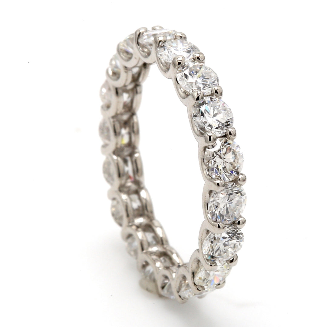 Eternity band in platinum with shared U-prong set (18) round diamonds.  D2.82ct.t.w.  Size 5.25