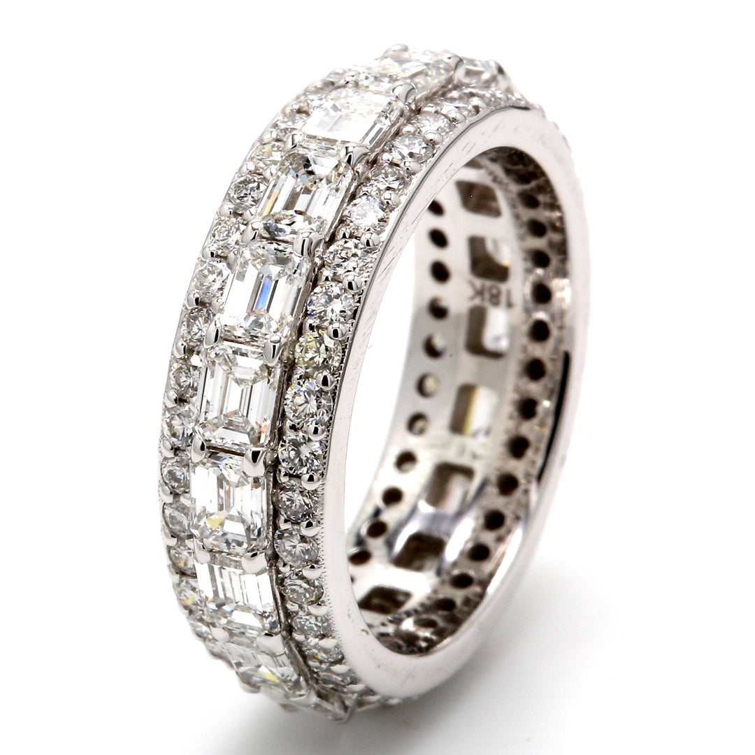 Eternity band in 18K WG with combination pave set round diamonds & side ways prong set (19) emerald cut diamonds.  D4.11ct.t.w.  Size 6.75