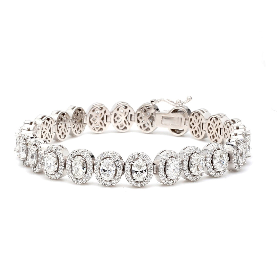 7"" Halo tennis bracelet with pave set rounds around prong set (24) oval diamonds.  D9.39ct.t.w.