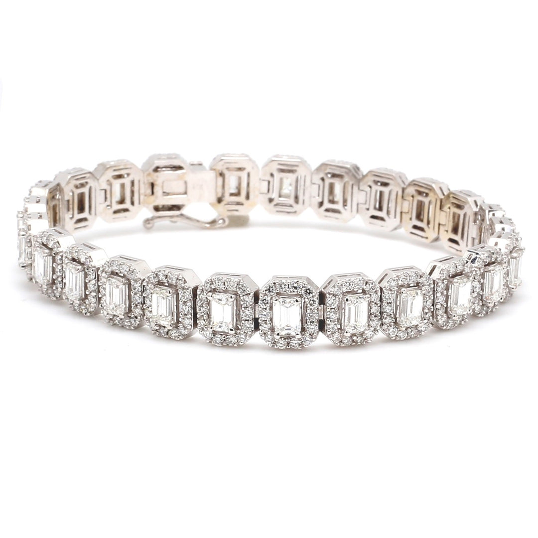7"" Halo tennis bracelet with pave set rounds around 4-prong set (26) emerald cut diamonds.  D8.77ct.t.w.