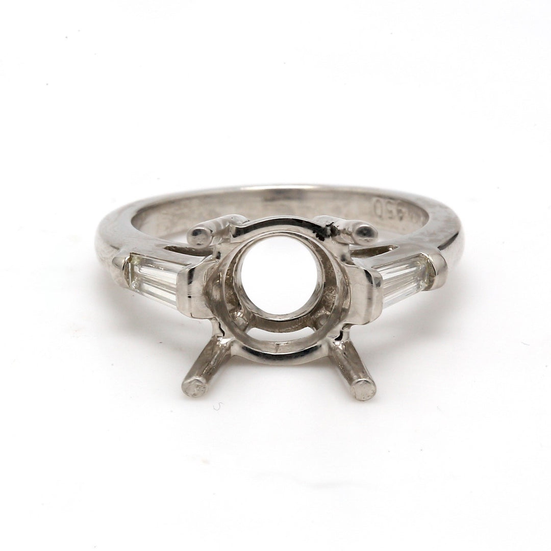 3-stone semi mount in platinum with baguette diamond sides.  D0.42ct.t.w.