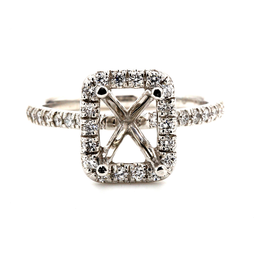 Halo semi-mount in platinum with U-prong set round diamonds.  D0.46ct.t.w.