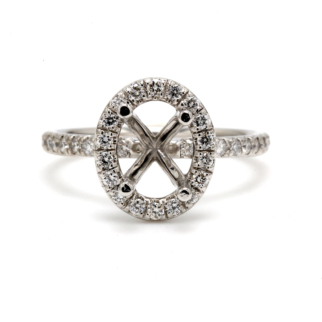 Halo semi mount  in white gold with U-prong set round diamonds. D0.42ct.t.w