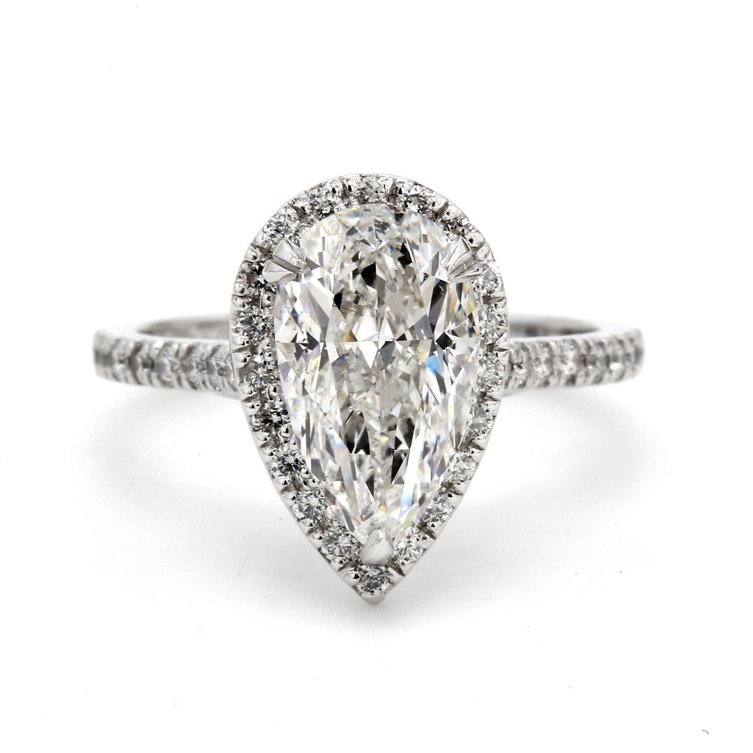Halo ring in platinum with rounds around U-prong set GIA certified D/SI1 round center.  D2.93ct.t.w.  (Center 2.51ct.)
