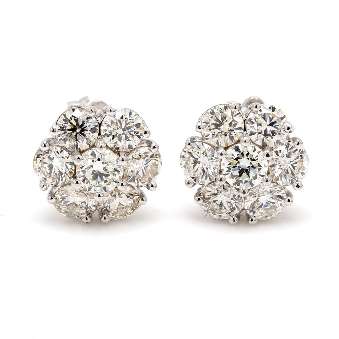 Push back cluster style earrings with shared prong set round diamonds.  D2.82ct.t.w.