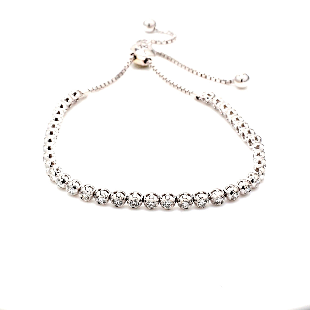 Bolo style adjustable tennis bracelet with prong & bezel set (40) round diamonds.  D1.26ct.t.w.