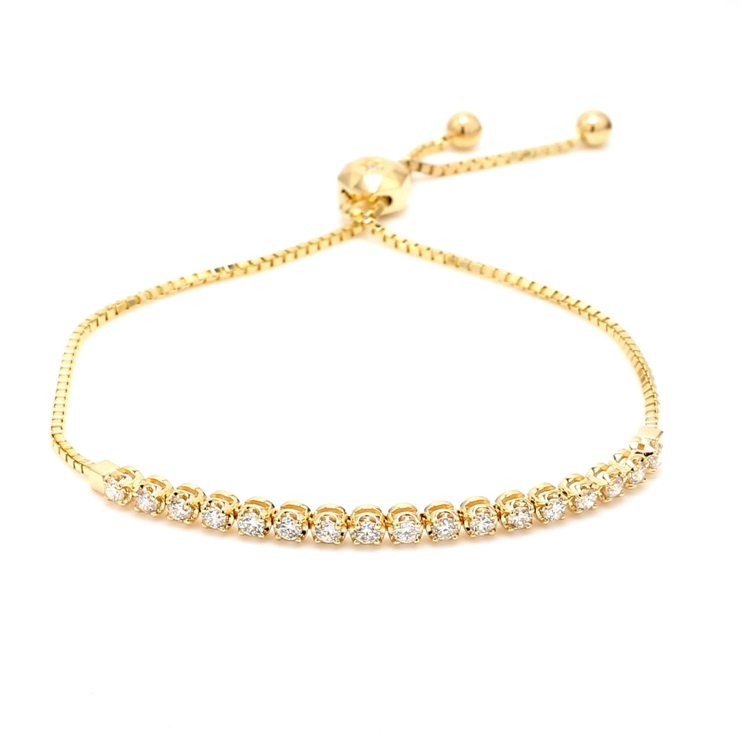 Bolo style adjustable tennis bracelet in yellow gold with 4-prong set (19) round diamonds.  D0.74ct.t.w.
