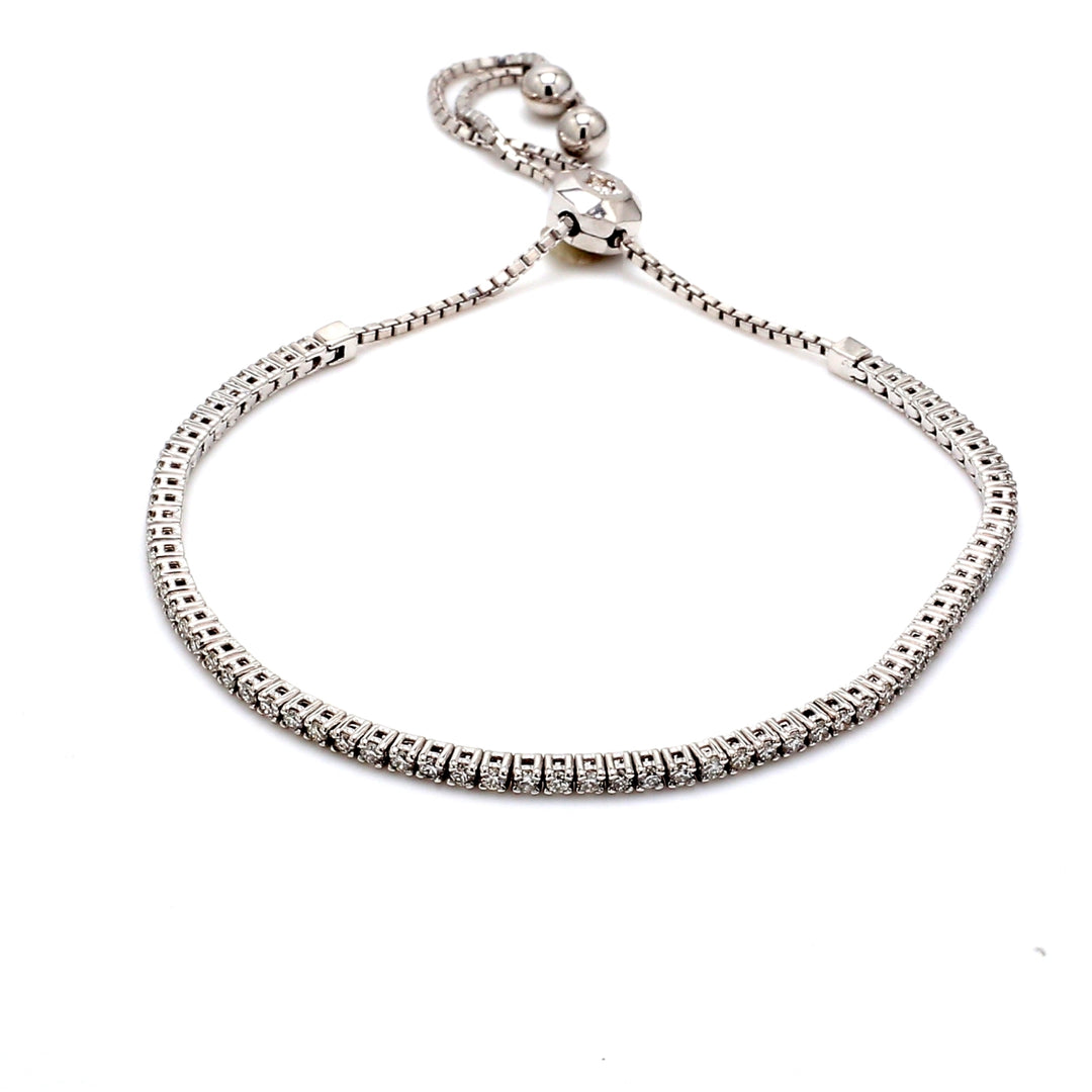 Bolo style adjustable tennis bracelet with 4-prong set (67) round diamonds.  D1.03ct.t.w.