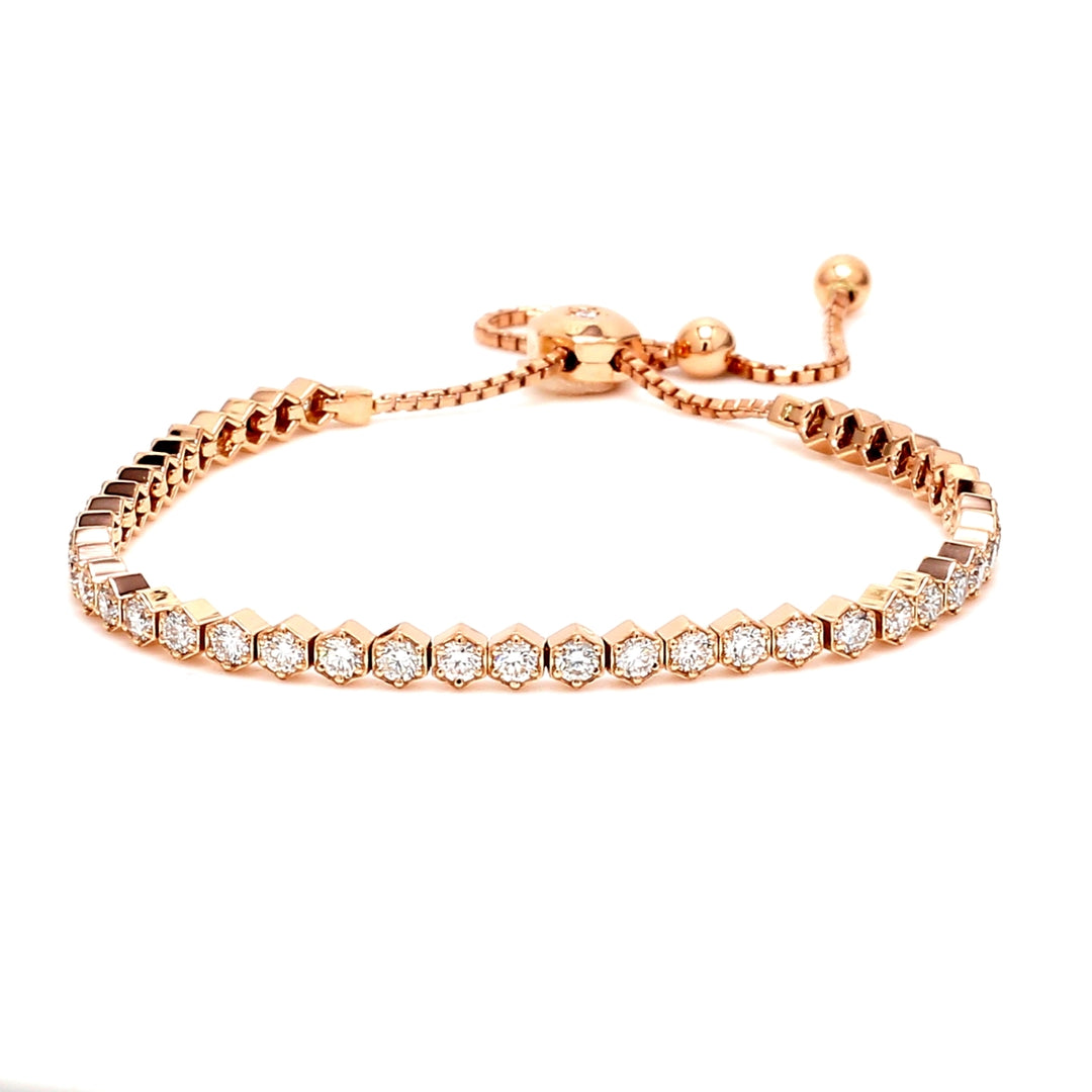 Bolo style adjustable tennis bracelet in rose gold with 6-prong set (45) round diamonds.  D2.19ct.t.w.