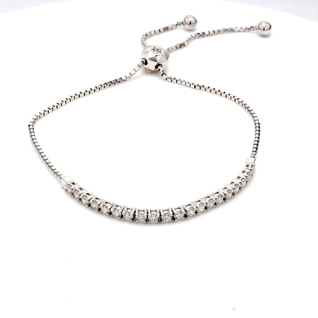 Bolo style adjustable tennis bracelet with 4-prong set (23) round diamonds.  D0.78ct.t.w.