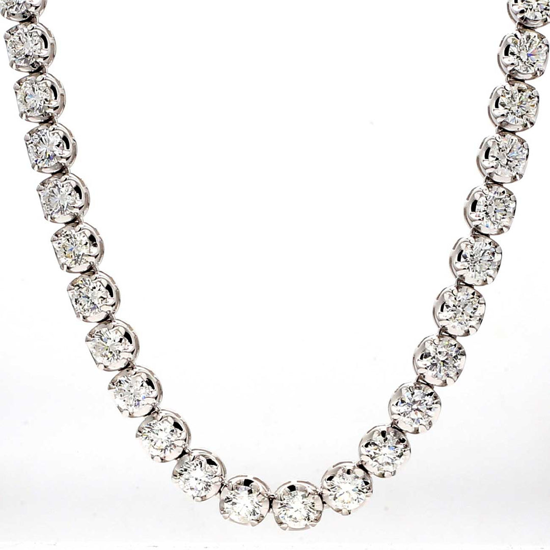 18"" Tennis necklace with illusion head 4-prong set (133) round diamonds.  D6.73ct.t.w.