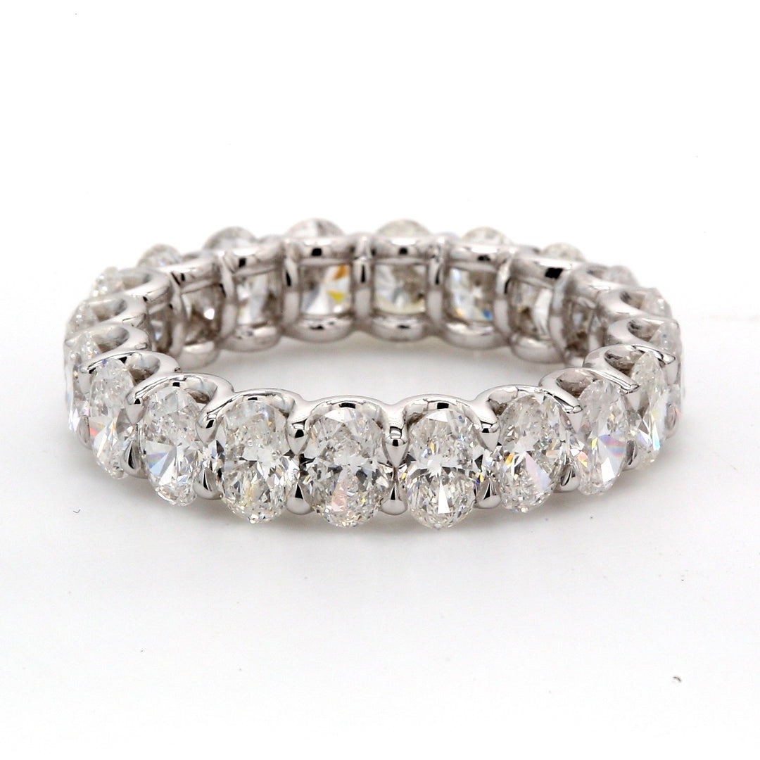Eternity band in platinum with shared U-prong set oval diamonds.  D4.40ct.t.w.  Size 4.5