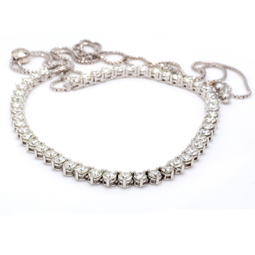 Bolo style adjustable tennis necklace with 3-prong set (51) round diamonds.  D13.00ct.t.w.