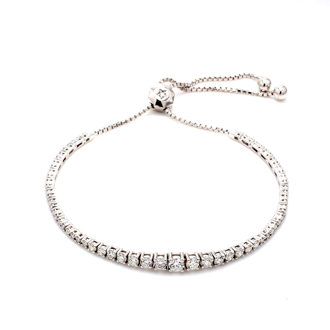 Bolo style adjustable graduated tennis bracelet with 4-prong set (67) round diamonds.  D1.75ct.t.w.