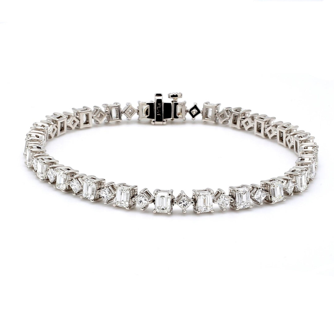 7"" Tennis bracelet in platinum with 4-prong set alternating emerald and princess cut diamonds.  D7.63ct.t.w.